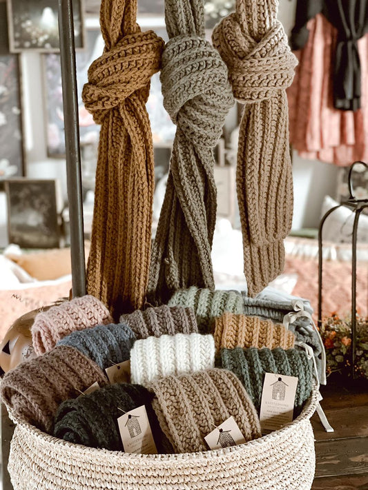 Knittedhome hand knit crochet straight scarves in basket and hanging in a knot at Baycreek & Co Monthly Market